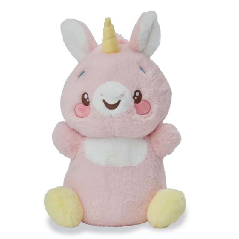 Pink unicorn plush toy with yellow horn and hooves, white belly, sitting pose