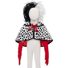 Black and white polka dot reversible cape with red trim on white background