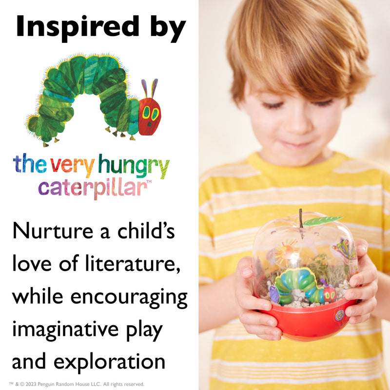 Child holding Very Hungry Caterpillar terrarium garden with caterpillar figure inside glass dome