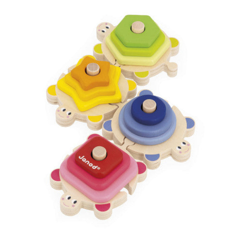 Four colorful wooden stackable turtle toys with hexagonal, star, circular and square shaped shells