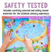 Child's hands playing with colorful butterfly garden sensory squish bag with gel and floating elements