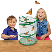 Two children watching butterflies emerge from Insect Lore Butterfly Farm habitat enclosure