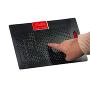 Hand demonstrating magnetic drawing board with red label and perforated black surface