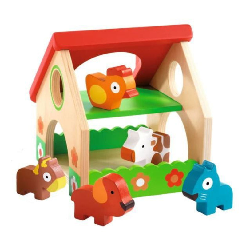 Colorful wooden farm house toy with farm animal figures on white background