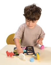 Child playing with Mentari Mood Board emotion learning toy with colorful wooden pieces