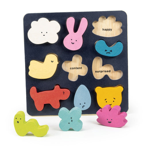 Mentari Mood Board wooden puzzle with colorful emotion-themed shapes on dark background