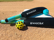 Waboba cricket set with bat, yellow and blue moon balls on sandy surface