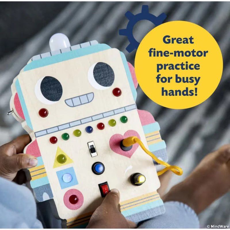 Child playing with colorful robot-shaped sensory board with buttons switches and fine motor activities