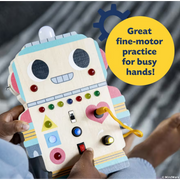 Child playing with colorful robot-shaped sensory board with buttons switches and fine motor activities