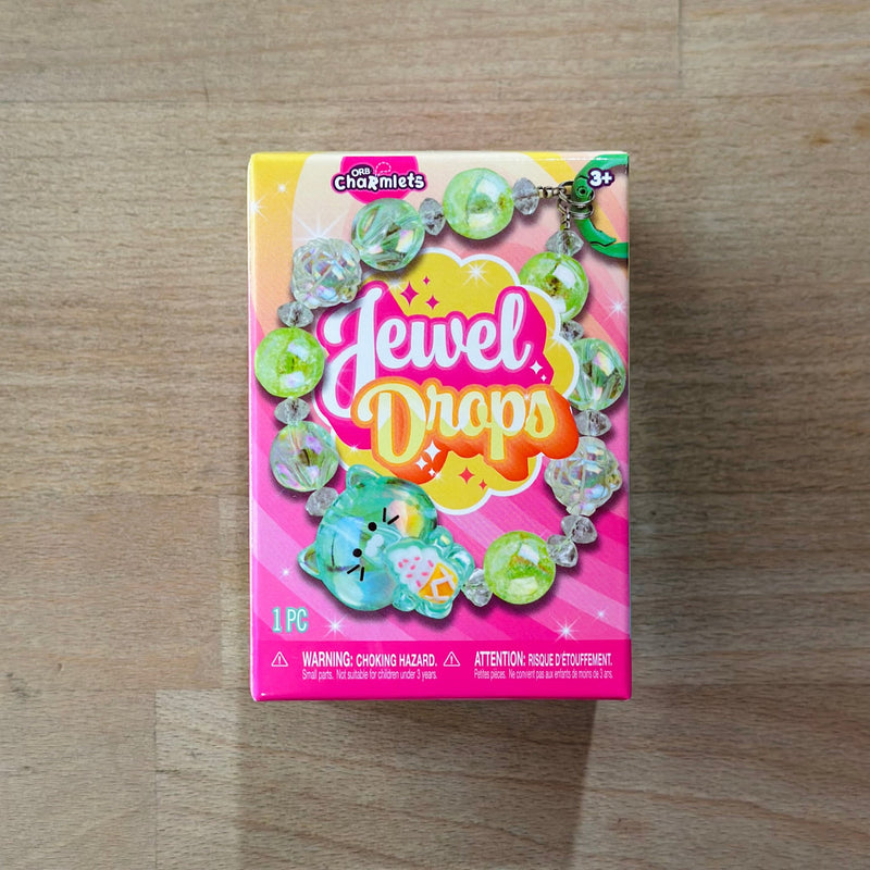 ORB Charmlets Jewel Drops bracelet with green and clear beads in retail packaging