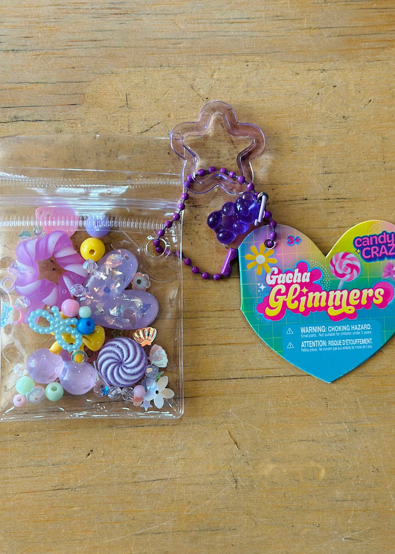 Gacha Glimmers candy-themed collectible toys with colorful beads and charms in clear packaging