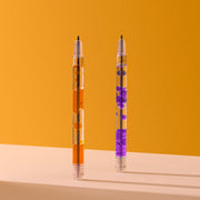Two clear scented lava pens with purple and orange liquid on orange background