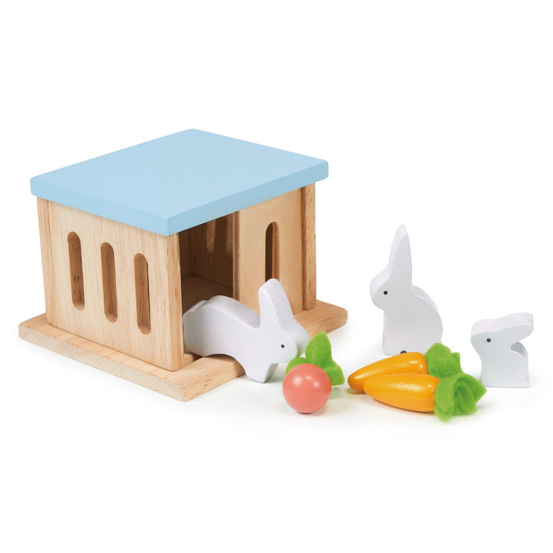 Wooden rabbit hutch toy set with blue roof, white rabbits and vegetables