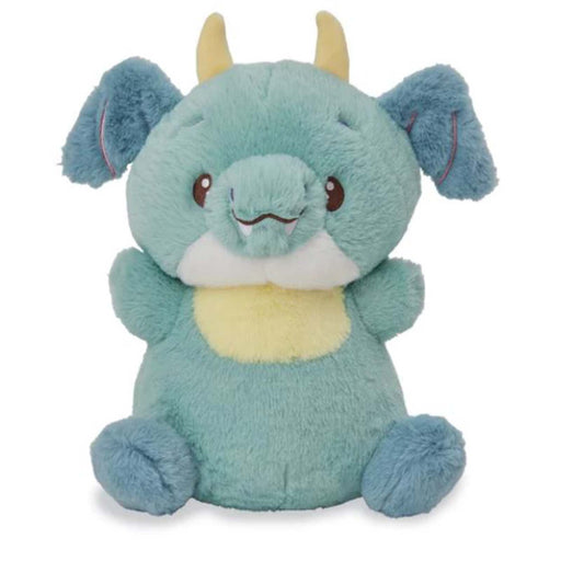 Teal dragon plush toy with blue ears and yellow horns on white background