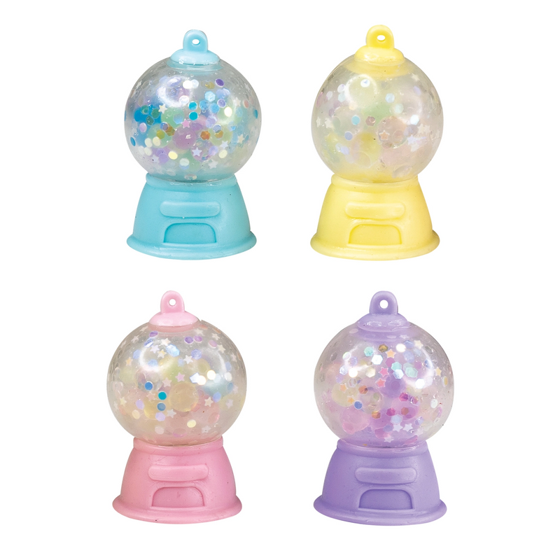 Four miniature gumball machine squishies in pastel colors with confetti filling