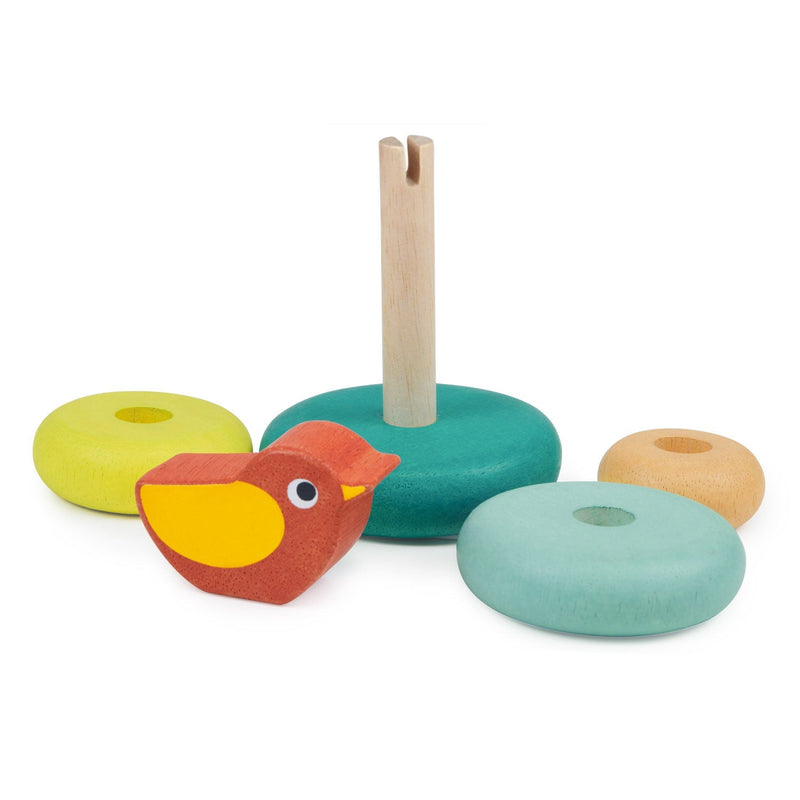 Wooden stacking toy with bird and colorful ring pieces on white background