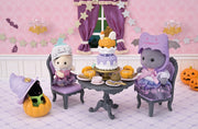 Calico Critters Halloween tea party scene with costumed figures and decorations