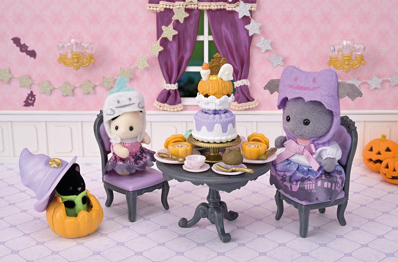 Calico Critters Halloween tea party scene with costumed figures and decorations