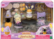 Calico Critters Halloween Surprise Party Set with characters and accessories in purple themed packaging
