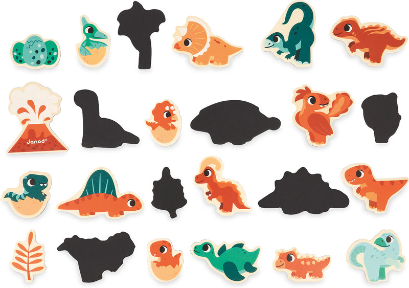 Colorful dinosaur-themed magnetic puzzle pieces with black silhouettes and bright cartoon dinosaurs