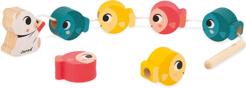Colorful wooden toy set with animal-shaped pieces and threading string on white background