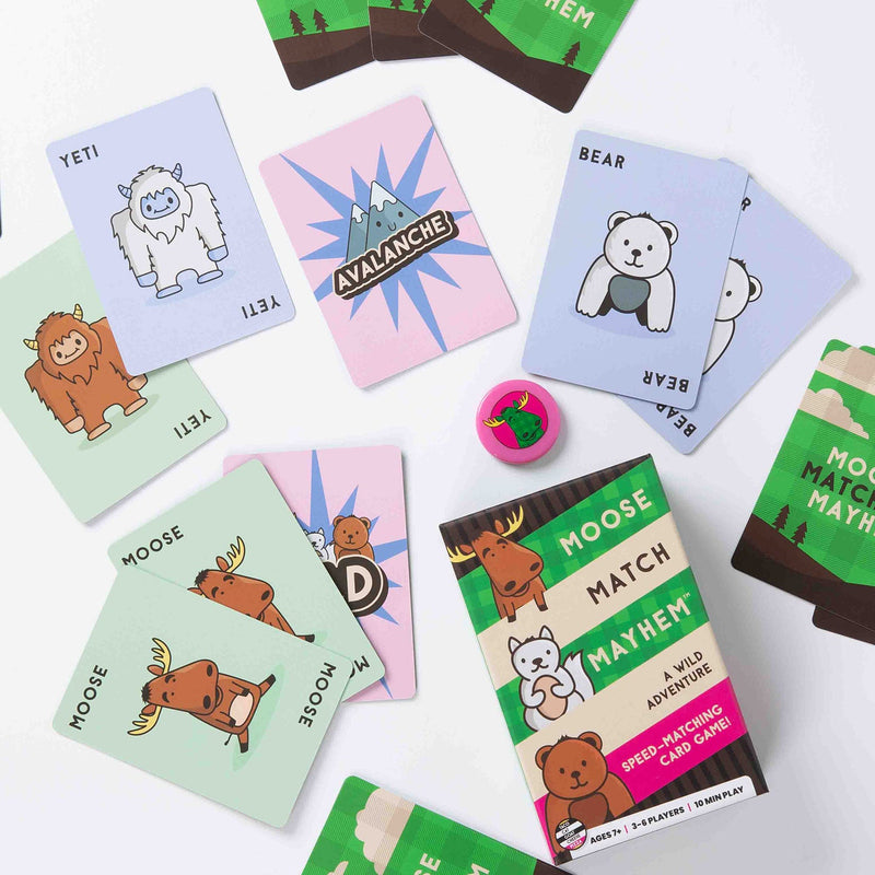 Moose Match Mayhem card game with colorful animal cards spread out showing gameplay.