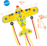 Yellow giant airplane kite with colorful circles and long streaming tails