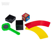 Magic trick set with colorful props including blocks, wand, and curved pieces