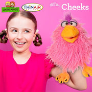 Young girl with pigtails holding pink fluffy Cheeks puppet with orange beak and purple hair