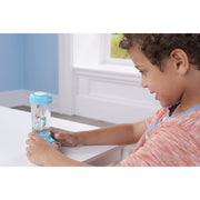Child playing with blue water game toy at white table