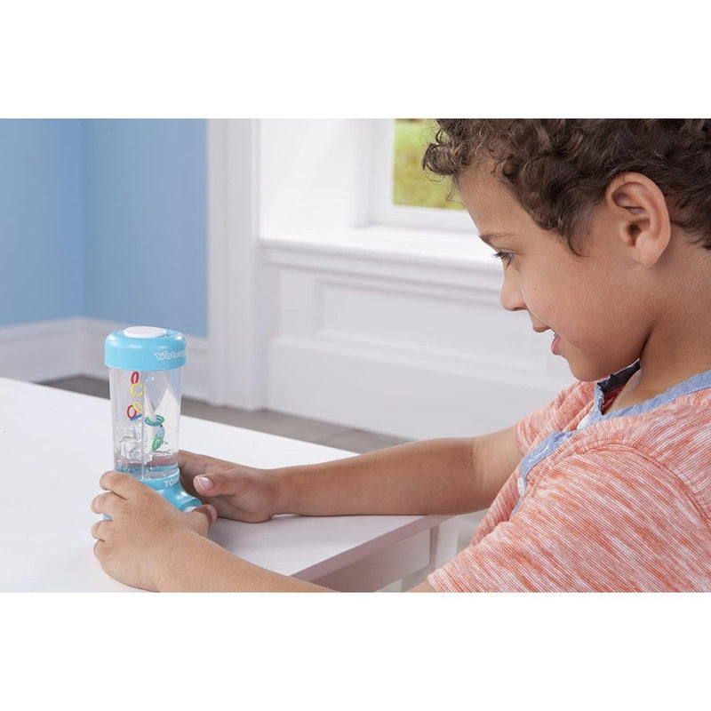 Child playing with blue water game toy at white table