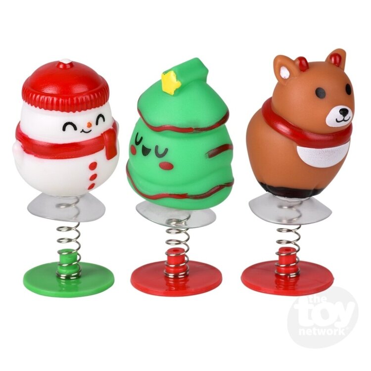 Three Christmas-themed pop-up toys with springs: snowman, tree, and bear