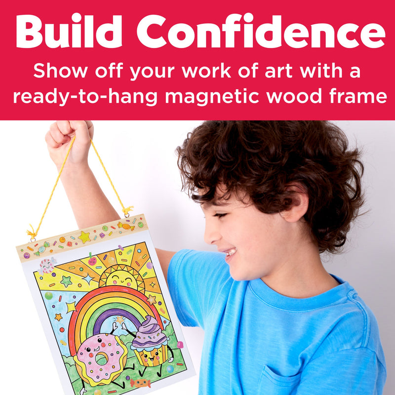 Child holding completed paint by number artwork featuring sweets rainbow and sun design