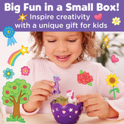Child playing with Mini Garden Pony in purple planter with unicorn and sprouts