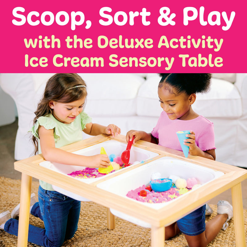Two children playing with wooden sensory table filled with colorful ice cream themed materials