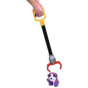 Hand holding yellow robot claw grabber toy with black handle gripping purple stuffed animal