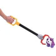 Hand holding yellow and black robot claw grabber toy picking up purple stuffed animal