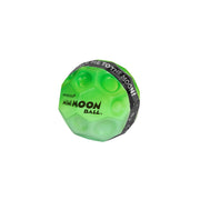 Green Waboba Mini Moon Ball with crater-like surface texture on white background