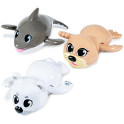 Three wind-up swimming bath toys featuring arctic animals: dolphin, seal, and polar bear