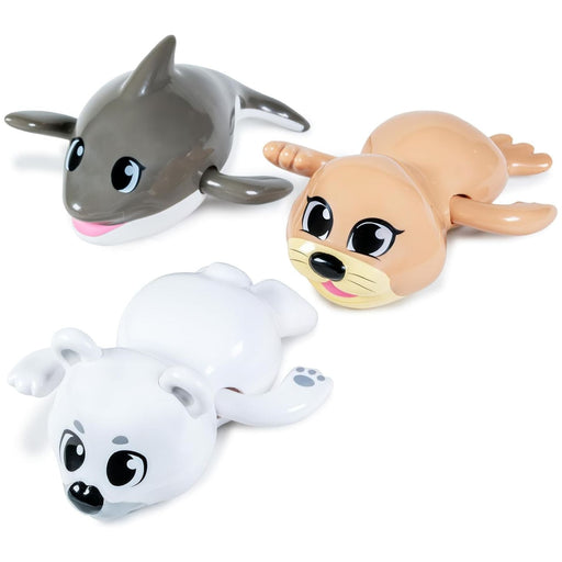 Three wind-up swimming bath toys featuring arctic animals: dolphin, seal, and polar bear