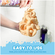 Hand holding fluffy orange foam soap being dispensed from spray bottle