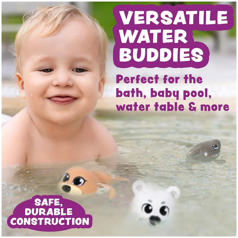 Baby playing with wind-up swimming arctic animal toys in water