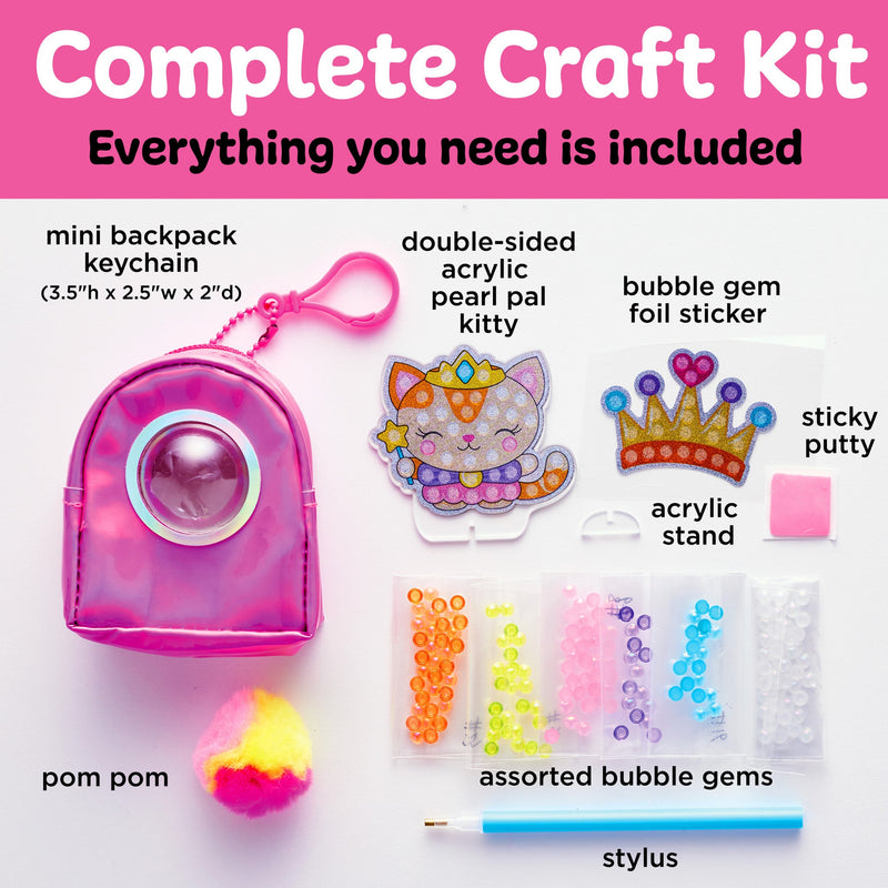 Complete craft kit with mini backpack keychain, acrylic kitty sticker, bubble gems, and crafting supplies
