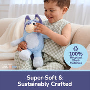 Child playing with blue Bluey plush toy highlighting 100% recycled materials