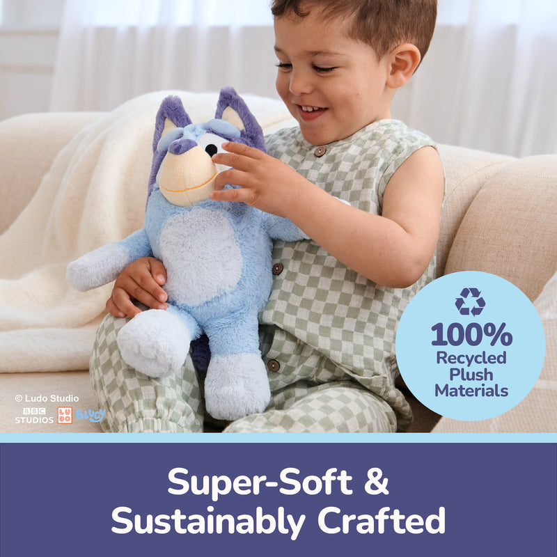Child playing with blue Bluey plush toy highlighting 100% recycled materials