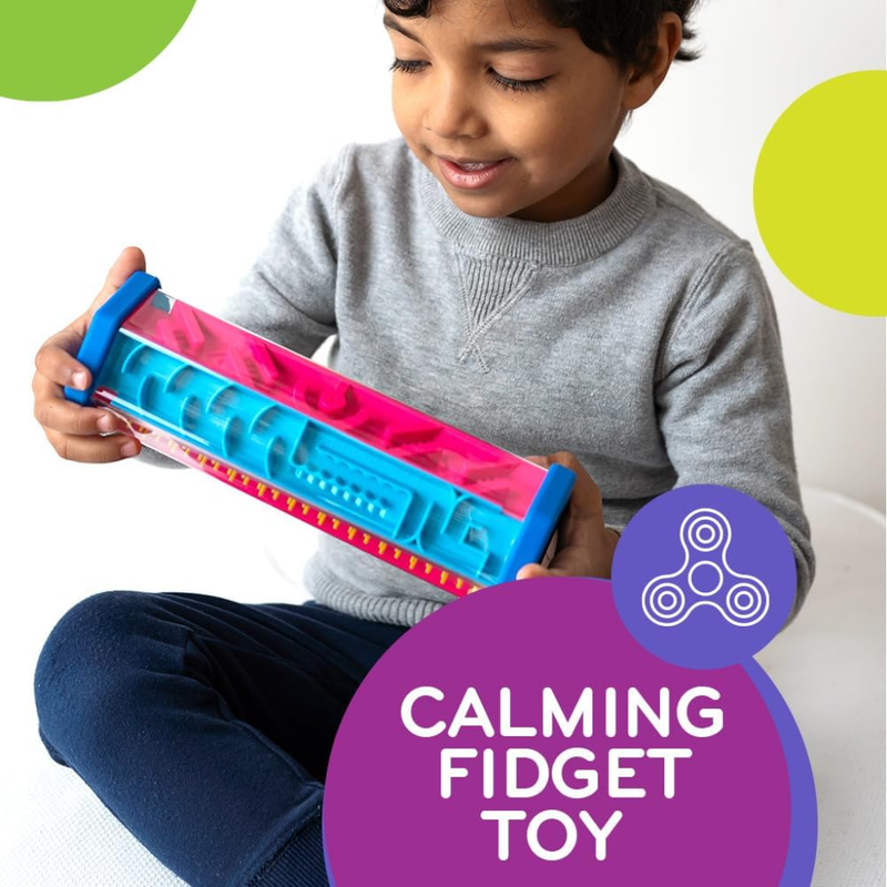 Child holding Zoomi as a fidget toy with colorful polka dots in the background.